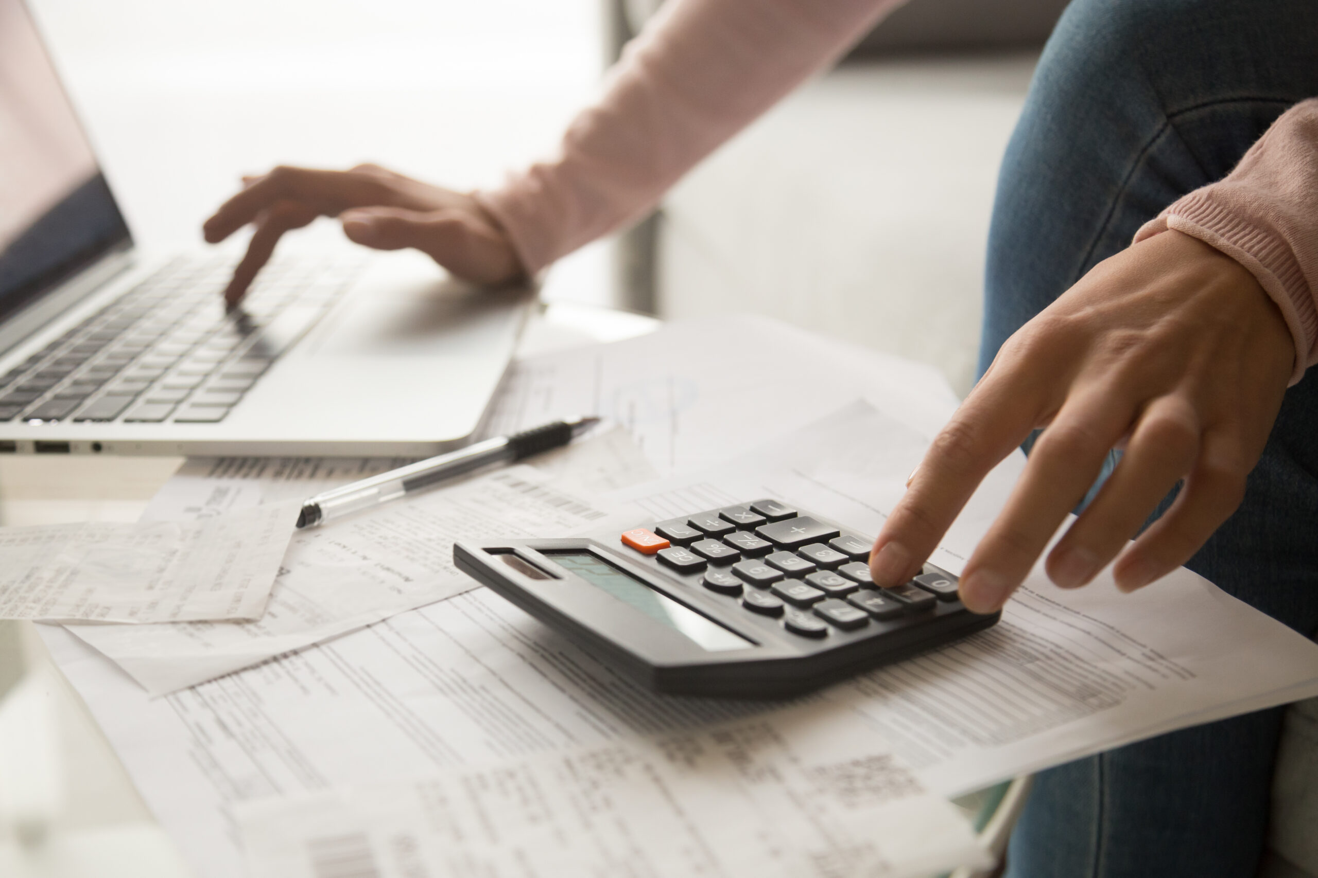 Close,Up,Cropped,Image,Young,Woman,Calculating,Monthly,Expenses,,Managing